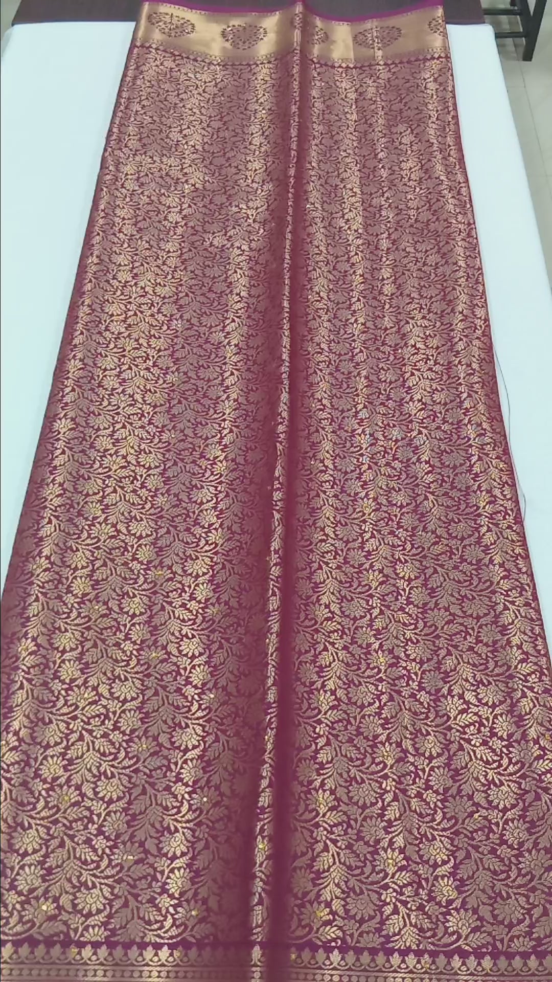 Kanchipuram Pure Silk Saree with detailed Gold Zari Butta motifs and luxurious Pallu with stick on Minakari in Maroon color