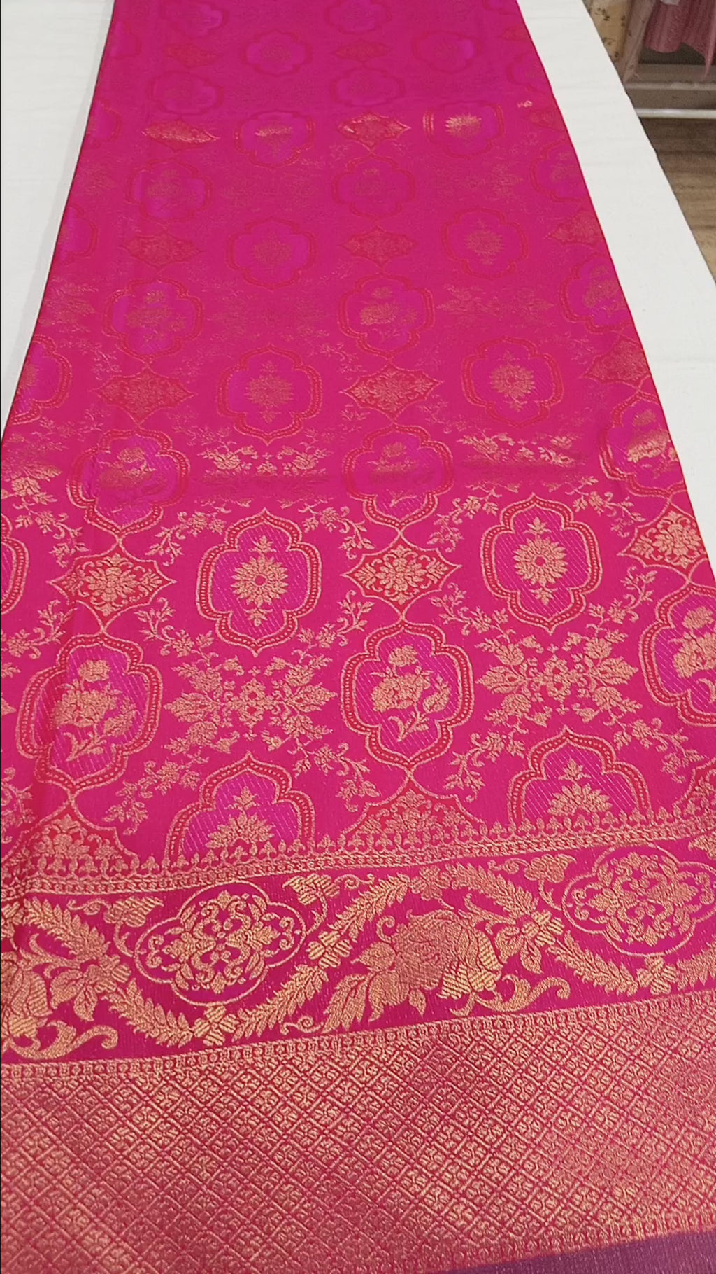 Kanchipuram Pure Silk Saree with detailed Butta motifs and luxurious Pallu in Royal Pink color