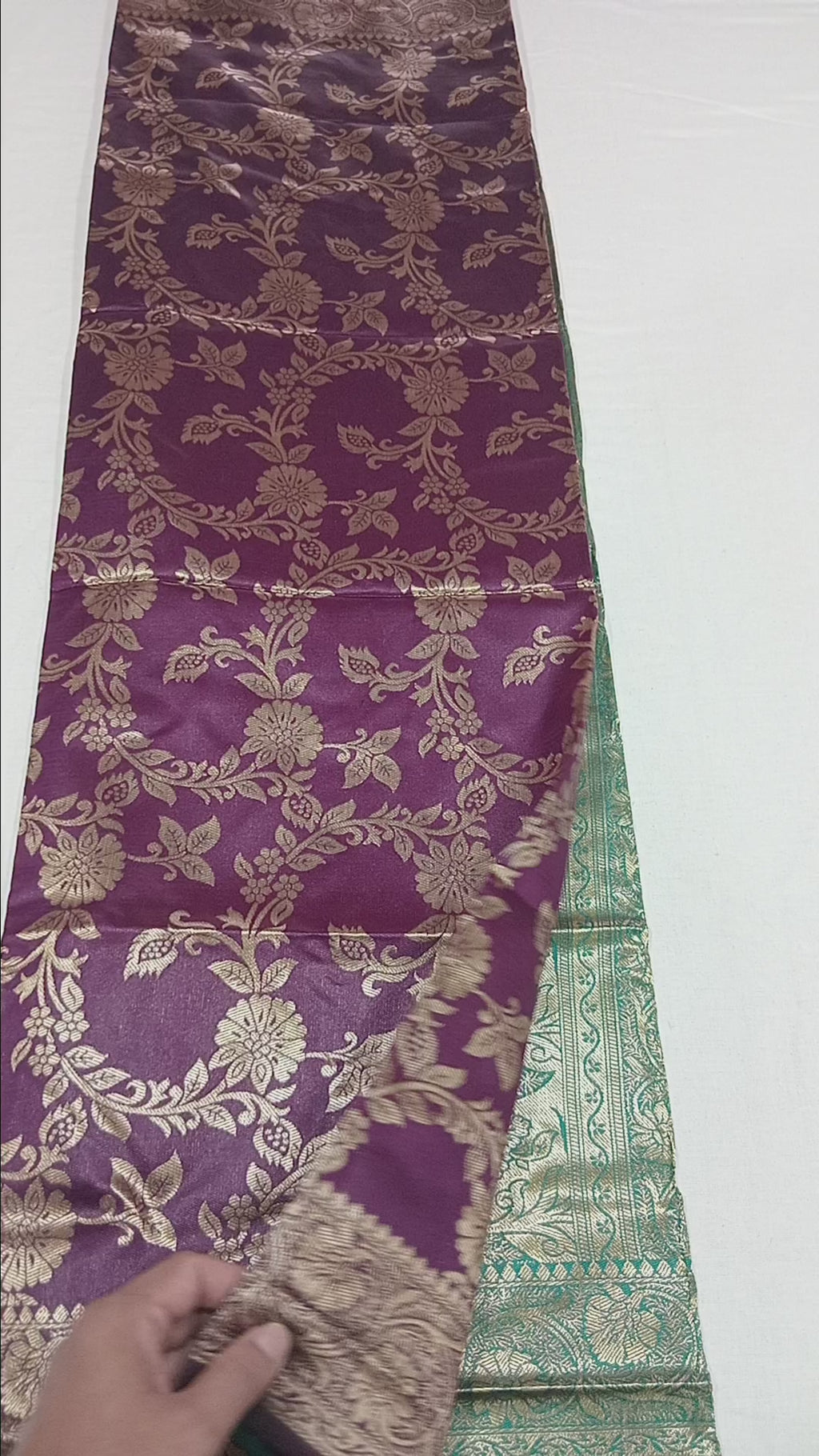 Banarasi Pure Silk Saree with luxurious Gold Zari Floral Buttas all over the saree and Pallu with leaf pattern in Purple Green Color