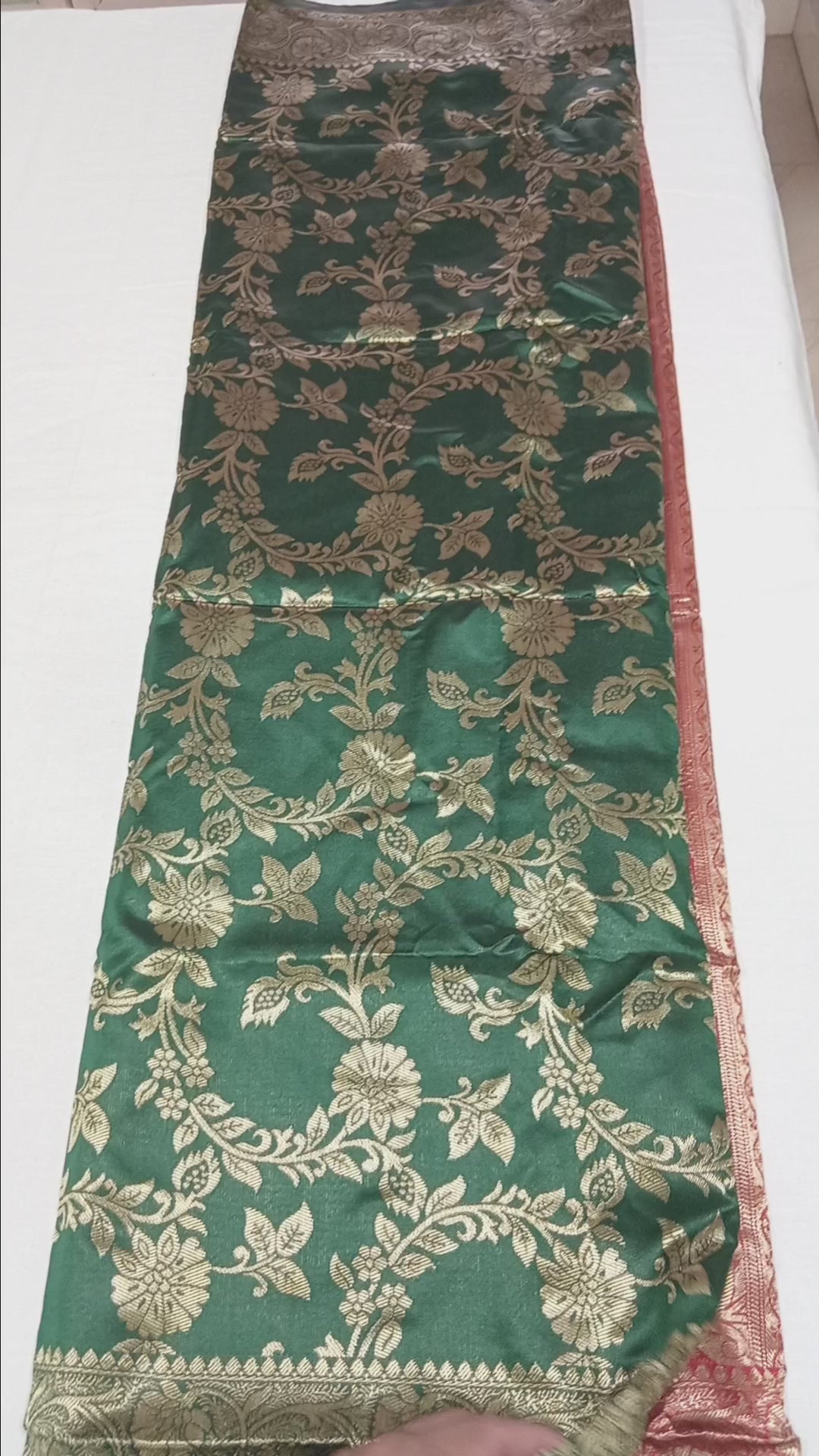 Banarasi Pure Silk Saree with luxurious Gold Zari Floral Buttas all over the saree and Pallu with leaf pattern in Leaf Green Red Color
