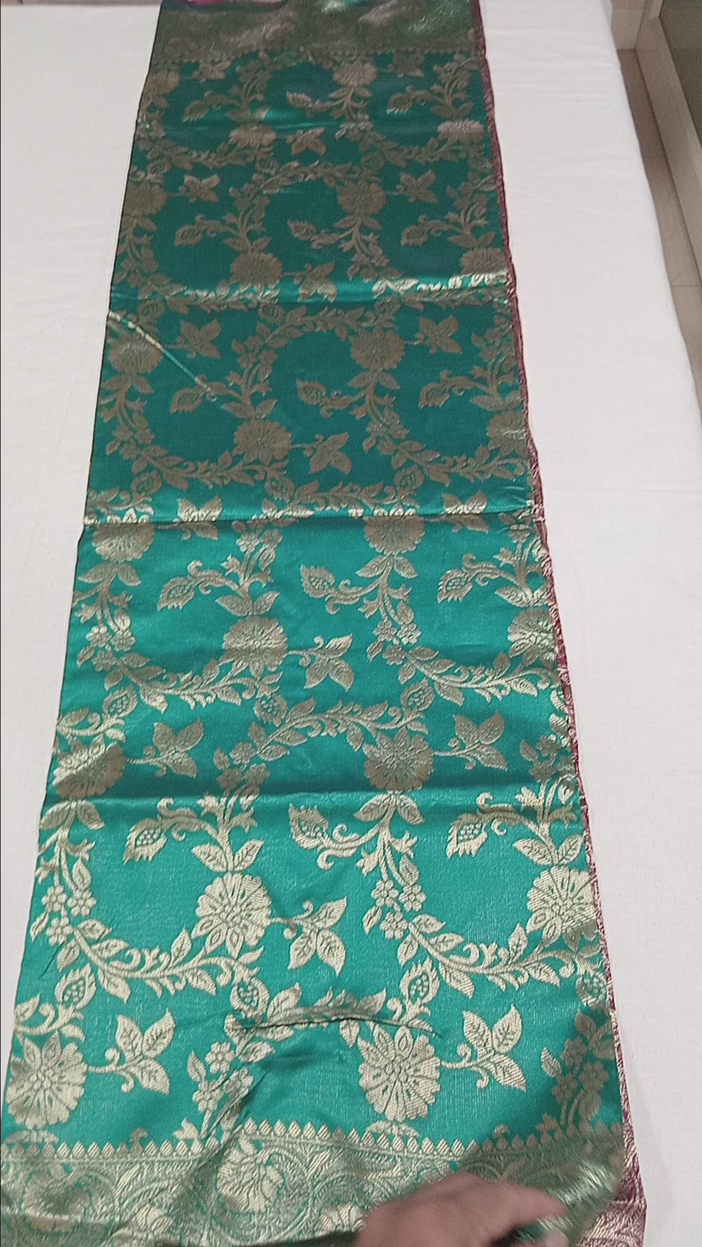 Banarasi Pure Silk Saree with luxurious Gold Zari Floral Buttas all over the saree and Pallu with leaf pattern in Turquoise Green Reddish Maroon Color