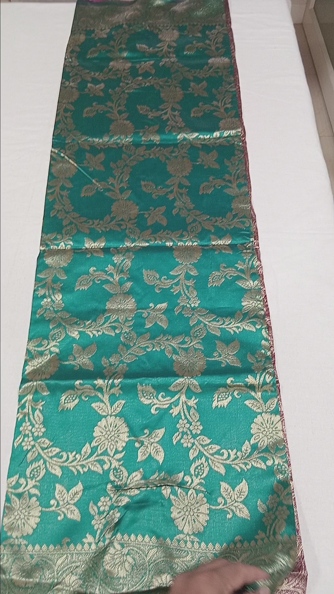 Banarasi Pure Silk Saree with luxurious Gold Zari Floral Buttas all over the saree and Pallu with leaf pattern in Turquoise Green Reddish Maroon Color