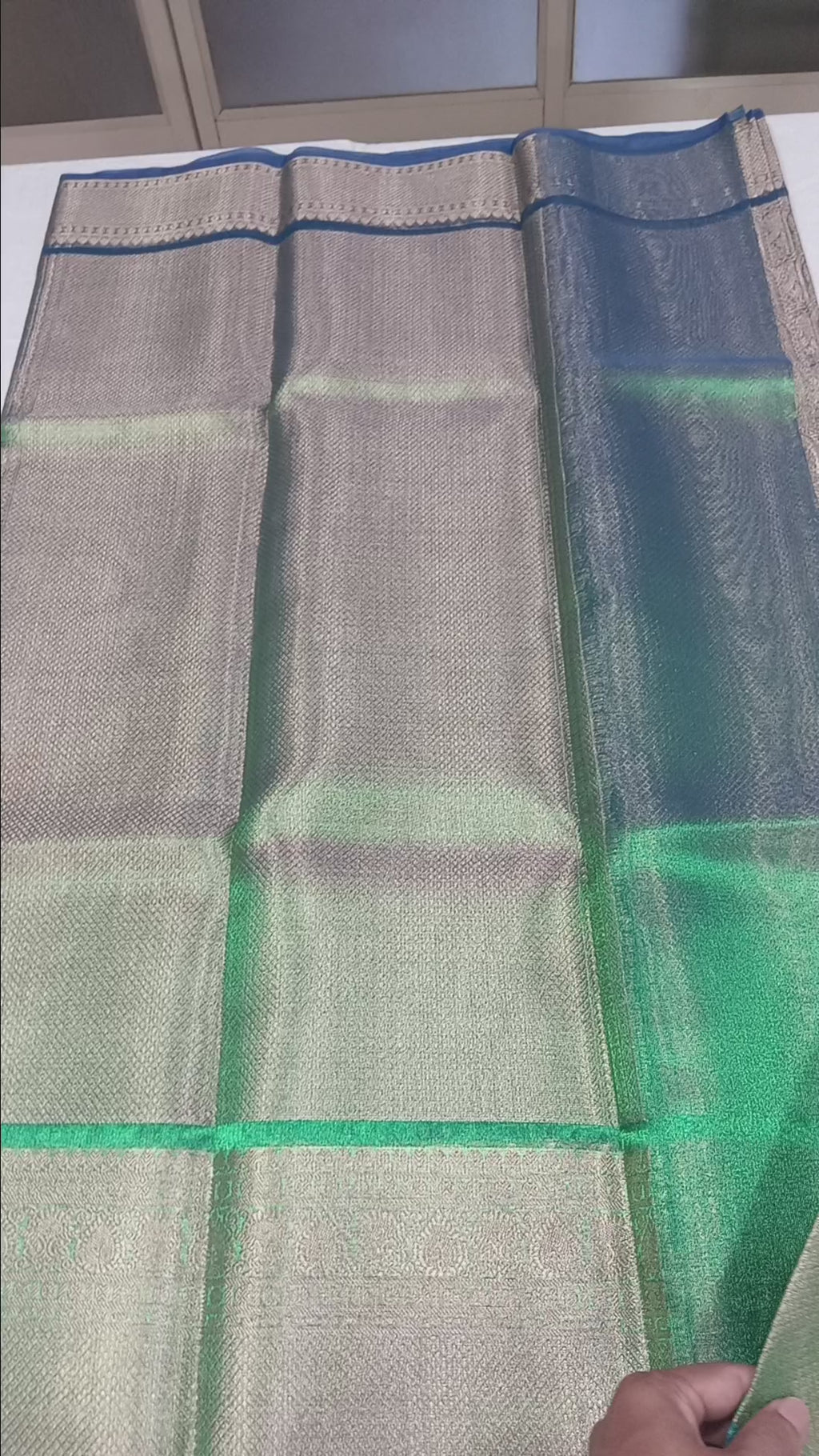 Kanchipuram Silk saree with Gold Zari pattern with Gold Butta all over saree and pallu in Greenish Green Color